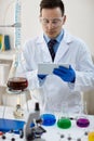 Scientist using analysis data in laboratory for experiment Royalty Free Stock Photo