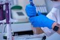 scientist using auto-pipette with Eppendorf consumables tube in the lab,Doing experiment for product