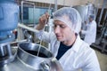 Scientist using brewer in the container Royalty Free Stock Photo