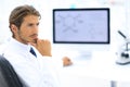 Scientist using computer and microscope in the laboratory Royalty Free Stock Photo