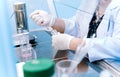 scientist using dropper pipette transfer sample