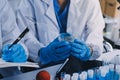Scientist using microscope in laboratory. Close-up of a researcher& x27;s hands adjusting microscope in lab setting. Scienc Royalty Free Stock Photo