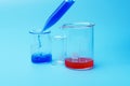 A scientist using a pipette analyzes a colored liquid to extract DNA and molecules in a laboratory glass. Royalty Free Stock Photo