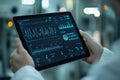 Scientist using tablet with futuristic interface, analyzing data and monitoring progress in high-tech laboratory Royalty Free Stock Photo
