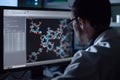 scientist viewing 3D models of protein structures on a monitor exploring potential drug targets