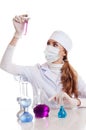 Scientist woman in lab with chemical glassware