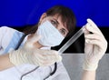 Scientist woman with test tube Coronavirus or COVID-19 against Estonia flag. Research of viruses in laboratory Royalty Free Stock Photo