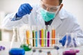 Scientist work research and analyses content of test tubes Royalty Free Stock Photo