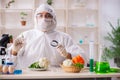 The scientist working in lab on gmo fruits and vegetables