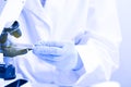 Scientist working with microscope at table in laboratory, closeup Royalty Free Stock Photo