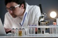 Scientist at workspace in laboratory with microscope, computer, and laboratory tools. Bio technology. Med students stuff. Medical Royalty Free Stock Photo