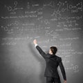 Scientist writing formulas on chalkboard Royalty Free Stock Photo
