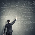 Scientist writing formulas on chalkboard Royalty Free Stock Photo