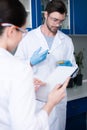 Scientists at chemical laboratory during work