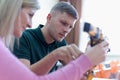 Scientists engineers designing small human robot, setting artificial intelligence humanoid robot. Artificial intelligence,