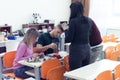 Scientists engineers designing small human robot, setting artificial intelligence humanoid robot. Artificial intelligence,