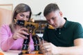 Scientists engineers designing small human robot, setting artificial intelligence humanoid robot. Artificial intelligence,