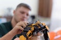 Scientists engineers designing small human robot, setting artificial intelligence humanoid robot. Artificial intelligence,
