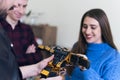 Scientists engineers designing small human robot, setting artificial intelligence humanoid robot. Artificial intelligence, Royalty Free Stock Photo