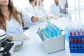 Scientists examining in the lab with test tubes. Royalty Free Stock Photo