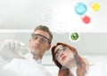 Scientists examining petri dish in lab Royalty Free Stock Photo