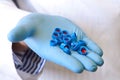 Scientists hand holds disposable caps