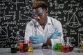 The scientists looked at the orange chemicals in the glass and smiled at the laboratory