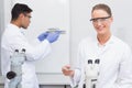 Scientists looking at petri dish and tubes Royalty Free Stock Photo