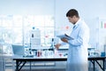 Scientists are researching and recording in science laboratories Royalty Free Stock Photo