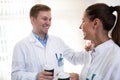 Scientists talking and holding coffee