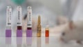 Scientists test lab rat, mouse with syringe. Scientist and lab rat Back ground. Coronavrius test tubes. Covid-19 vaccine. Royalty Free Stock Photo