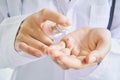 Scientists are using white cream from a bottle to clean his hands. Hygienic concept in hygiene and prevention of germs. Royalty Free Stock Photo