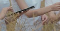 Scientists working in field with agriculture technology. Close up of woman hand touching tablet pc in wheat stalks