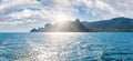 Scintillate sea surface and evening sunshiny summer rocky coastline, Crimea, Ukraine