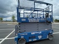 Scissor lift in a parking lot side view