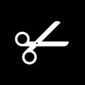 Scissor vector icon isolated on black background.