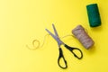 Scissors cut curled organic rope from two colored coils for packing gifts