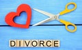 Scissors cut heart. the inscription `divorce`. the concept of breaking relations, quarrels. treachery, betrayal. cancellation of m Royalty Free Stock Photo