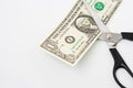Scissors cuts one american dollar note Royalty Free Stock Photo