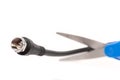 Scissors cutting through a coaxial RG6 cable Royalty Free Stock Photo