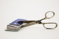 Scissors cutting plastic credit cards reducing debt