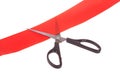 Scissors cutting red ribbon Royalty Free Stock Photo