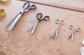 Scissors of different sizes on the table of the tailor