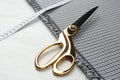 Scissors, fabric and measuring tape on white wooden table, closeup Royalty Free Stock Photo