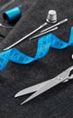Scissors, needles and tape measure close-up