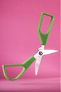 Scissors opened isolated in pink background