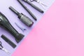 Scissors and other hairdresser's accessories on lilac-pink background, flat lay. Space for text Royalty Free Stock Photo