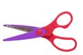 scissors plastic colored red and purple isolated on white background. Royalty Free Stock Photo