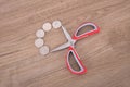 Scissors and some dollar coins Royalty Free Stock Photo