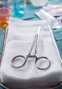 Scissors for surgery on a tray, Gauzes sterile in operating room, conceptual image Royalty Free Stock Photo